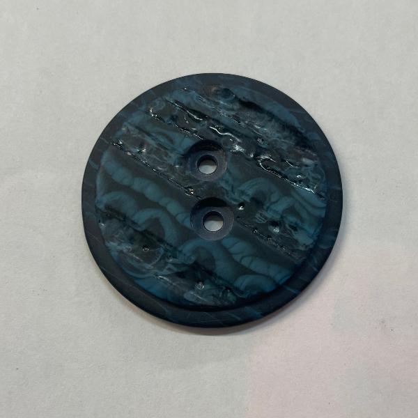 product photo of two-hole button in marbled blue and black plastic