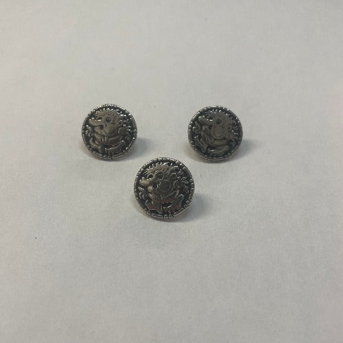 three metal buttons with traditional Nordic troll decoration